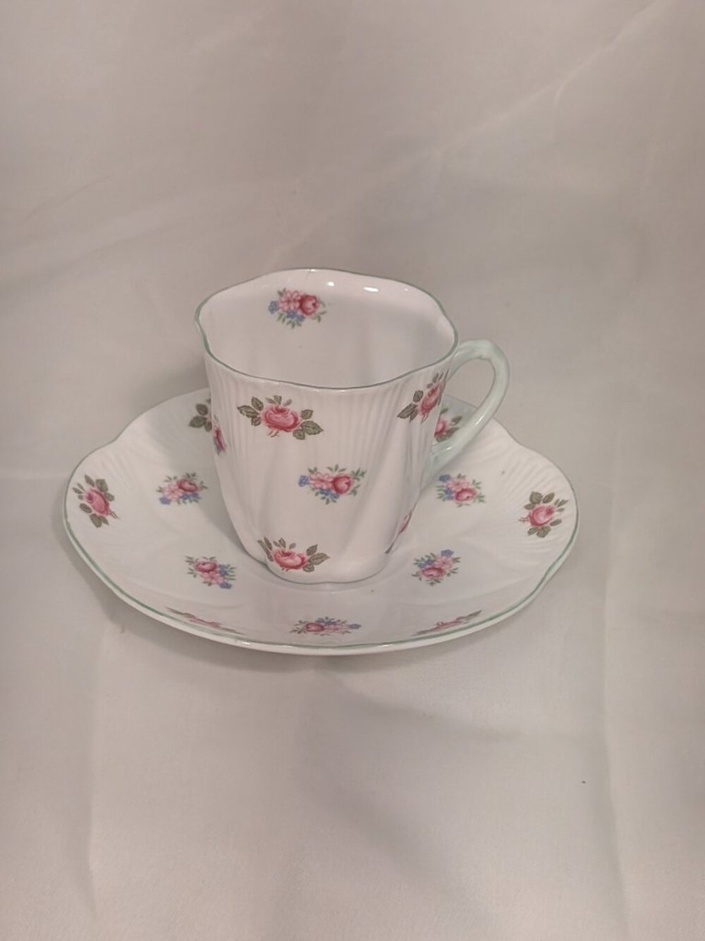 SHELLEY DEMITASSE CUP AND SAUCER IN THE  "ROSEBUD"  PATTERN  "DAINTY" SHAPE